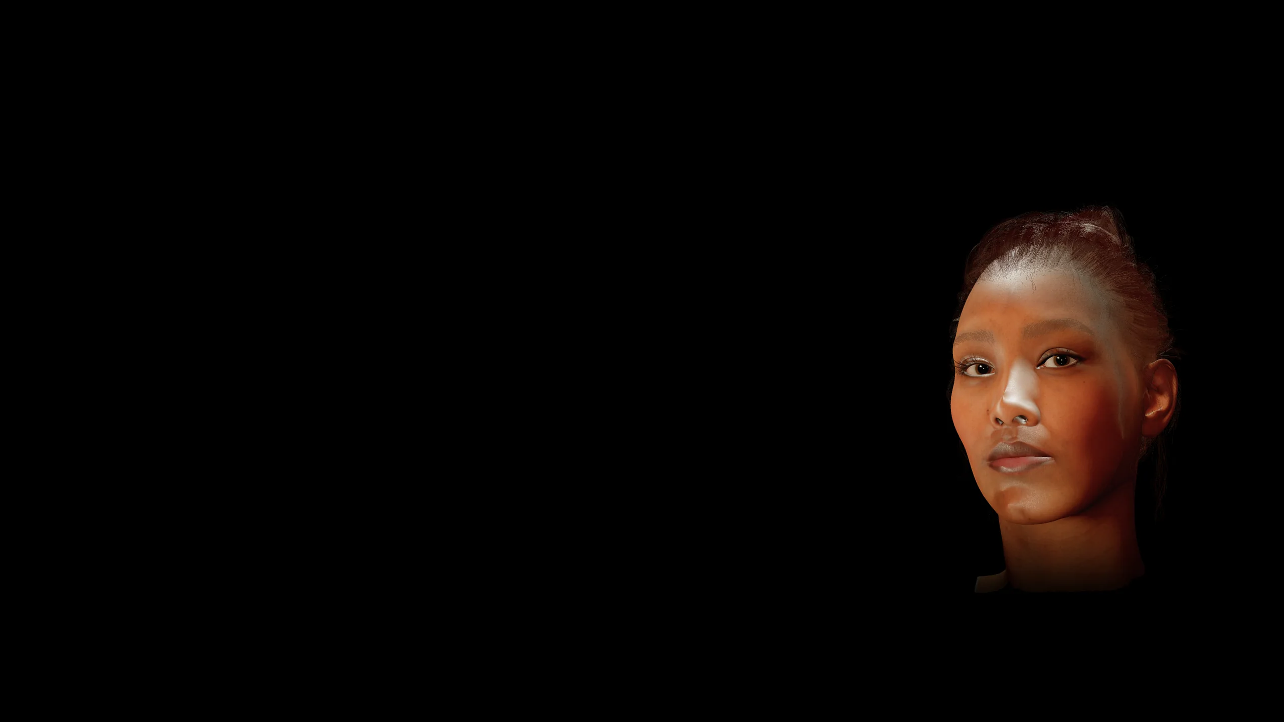A black Mac desktop. At the lower right edge, the Tvaily character — a warmly lit face, drawn directly on the desktop — looks toward the viewer.